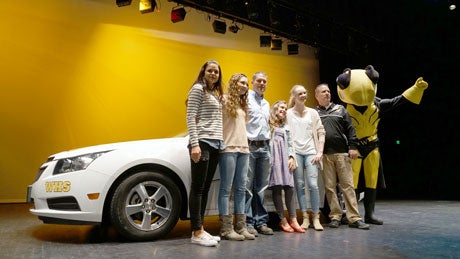 Toree standing beside her new Chevy Cruze with Wasatch High School principle and Danny Labrum and family.