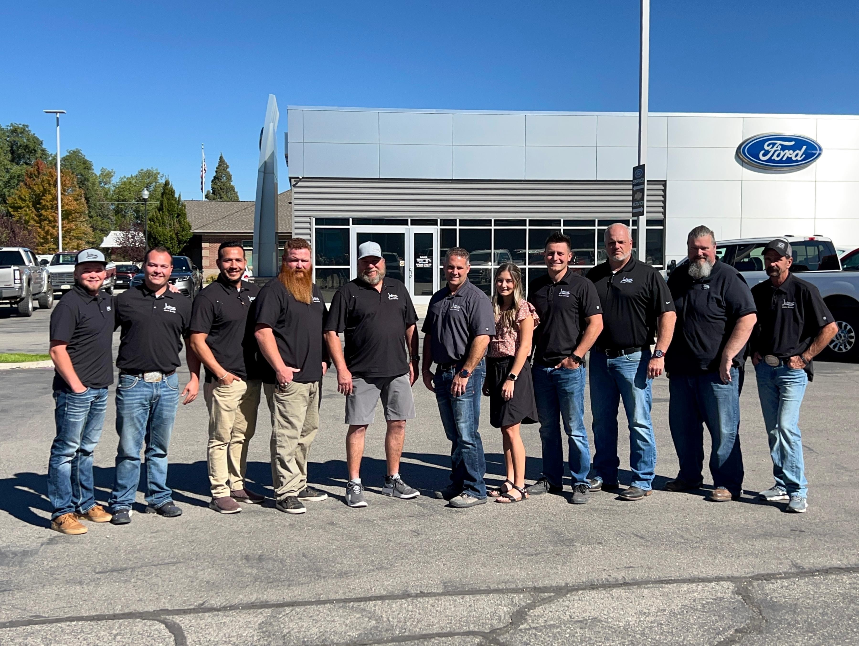 Photo of people in front of the labrum dealership