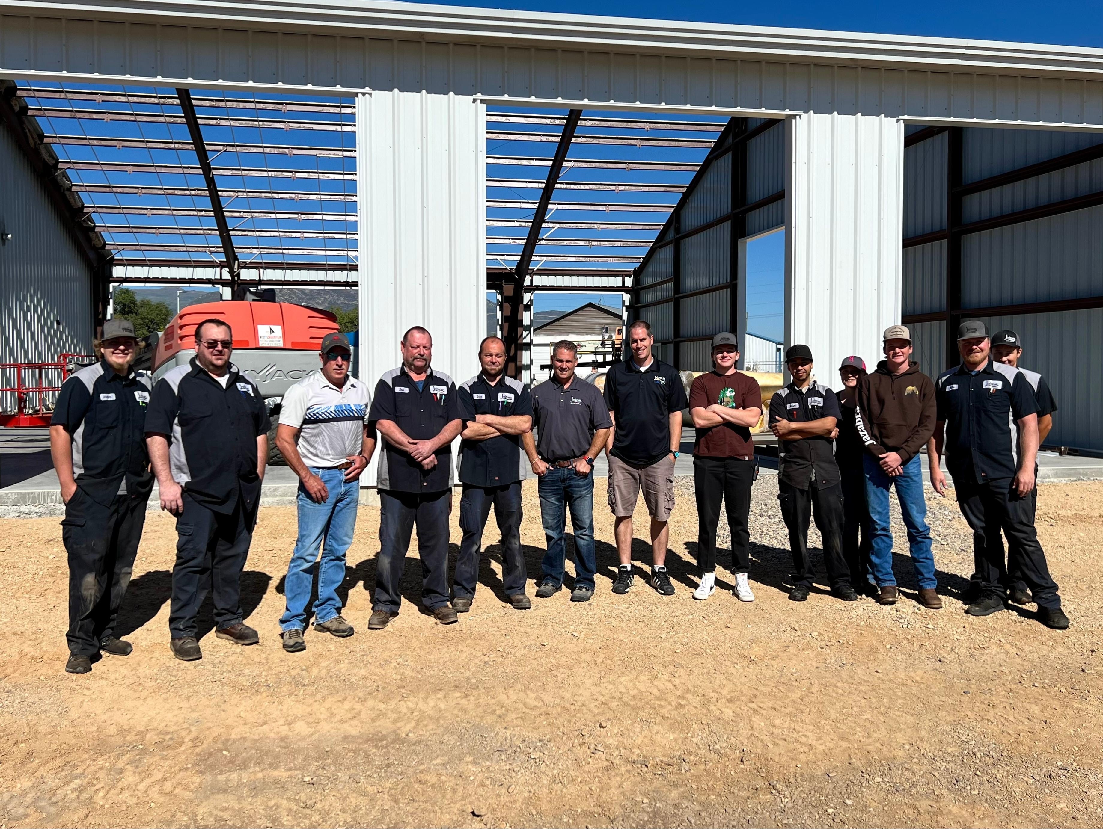 Photo of people in front of the labrum dealership